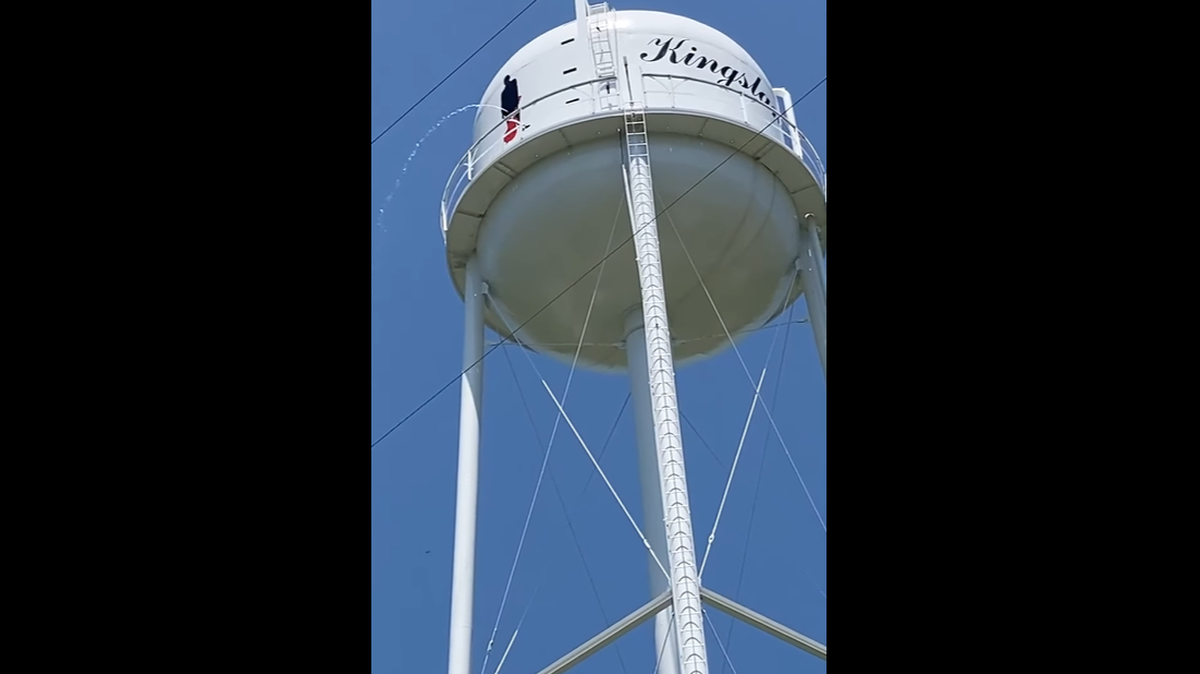 A water tower bearing a mural of Johnny Cash was shot in Arkansas, causing it to leak in a crude way.