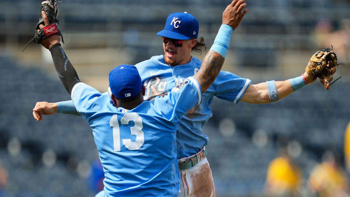 Kansas City Royals shortstop Bobby Witt Jr. (7) celebrates with catcher Salvador Perez (13) after defeating the New York Mets at Kauffman Stadium.