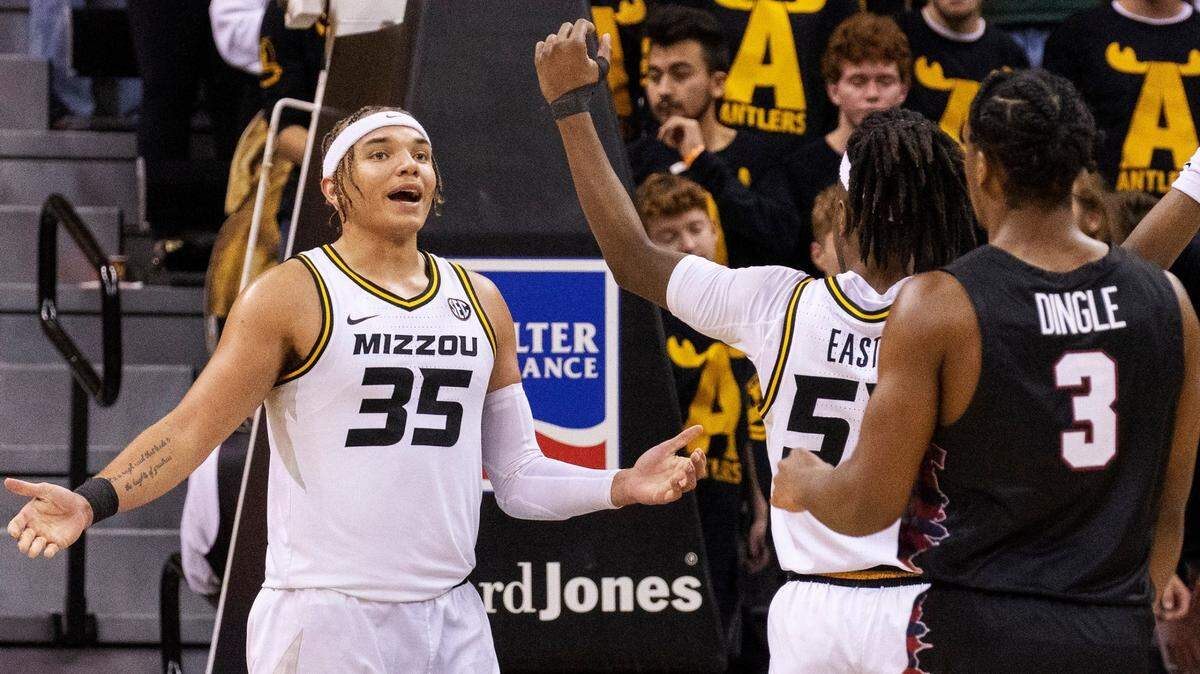 Missouri’s Noah Carter, left, celebrates a called foul on the Penn Quakers with teammate Sean East II in Columbia Friday night at Mizzou Arena.