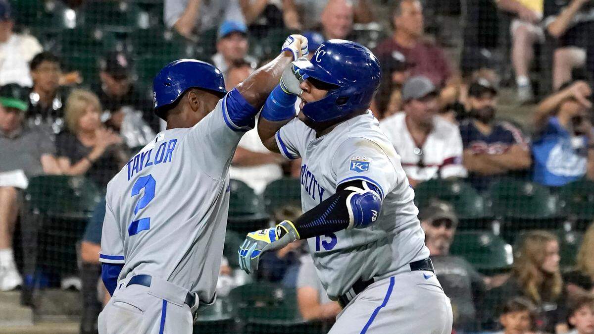 Kansas City Royals’ Salvador Perez, right, is congratulated by Michael A. Taylor after they scored on Perez’s two-run home run off Chicago White Sox’s Lucas Giolito during the third inning of a baseball game Tuesday, Aug. 30, 2022, in Chicago. (AP Photo/Charles Rex Arbogast)
