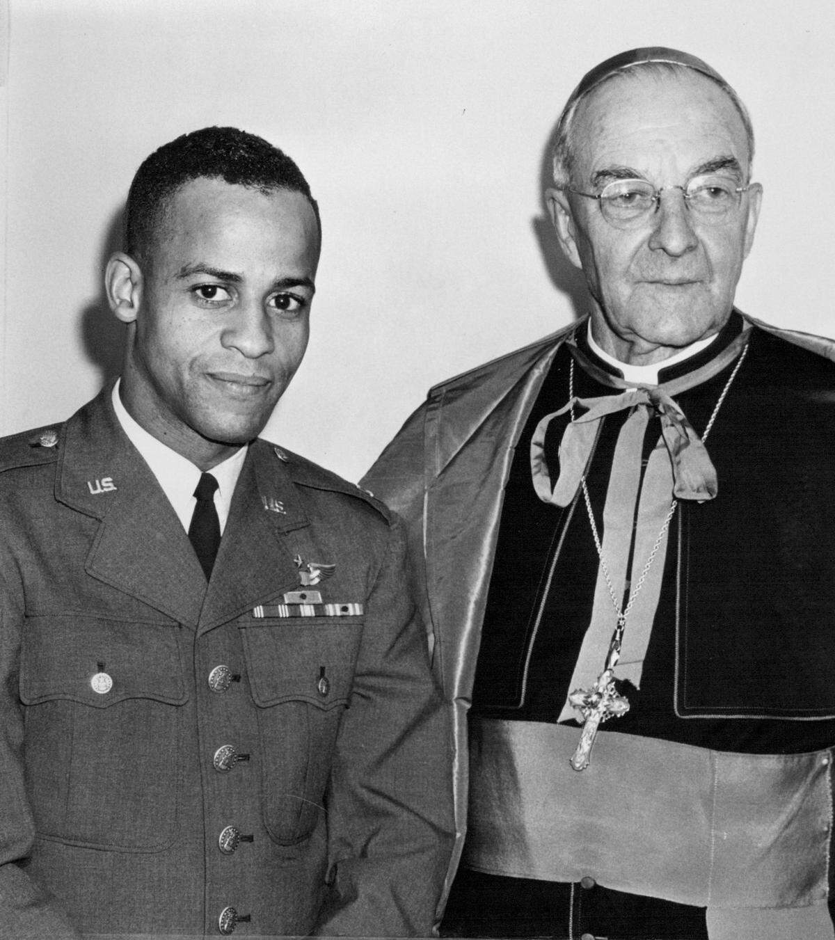 On a 1963 return home, Dwight, a 1951 Bishop Ward graduate then training to be an astronaut, met with the Most Rev. Edward J. Hunkeler, archbishop of the Roman Catholic Diocese of Kansas City in Kansas.