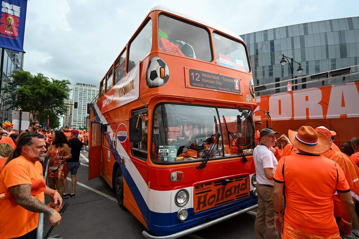 The Orange Bus and Dutch supporters are ready for the Netherlands Orange Walk from Kansas City's Power & Light District to FIFA Fan Fest on June 25, 2026.