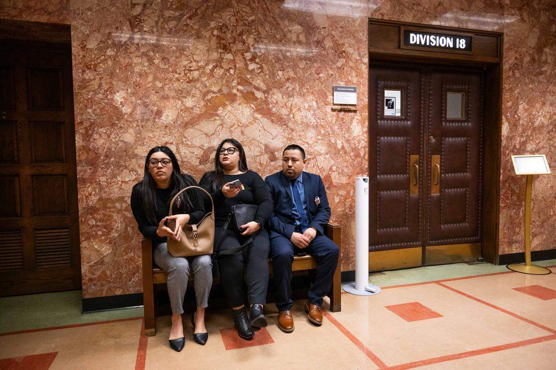 Family members of Lisa Lopez-Galvan, sit outside the courtroom prior to the plea hearing for Dominic Miller, at Jackson County Courthouse, on Monday, March 9, 2026, in Kansas City. Miller is accused of fatally shooting Lopez-Galvan during the 2024 Chiefs Super Bowl rally mass shooting.
