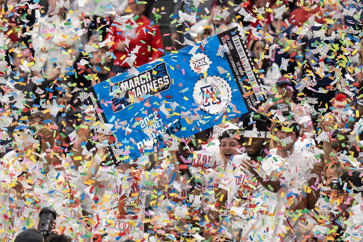 Confetti falls as the Arizona players celebrate after defeating the Houston 79-74 in the Big 12 Men's Basketball Tournament Championship game at T-Mobile Center on Saturday, March 14, 2026, in Kansas City.