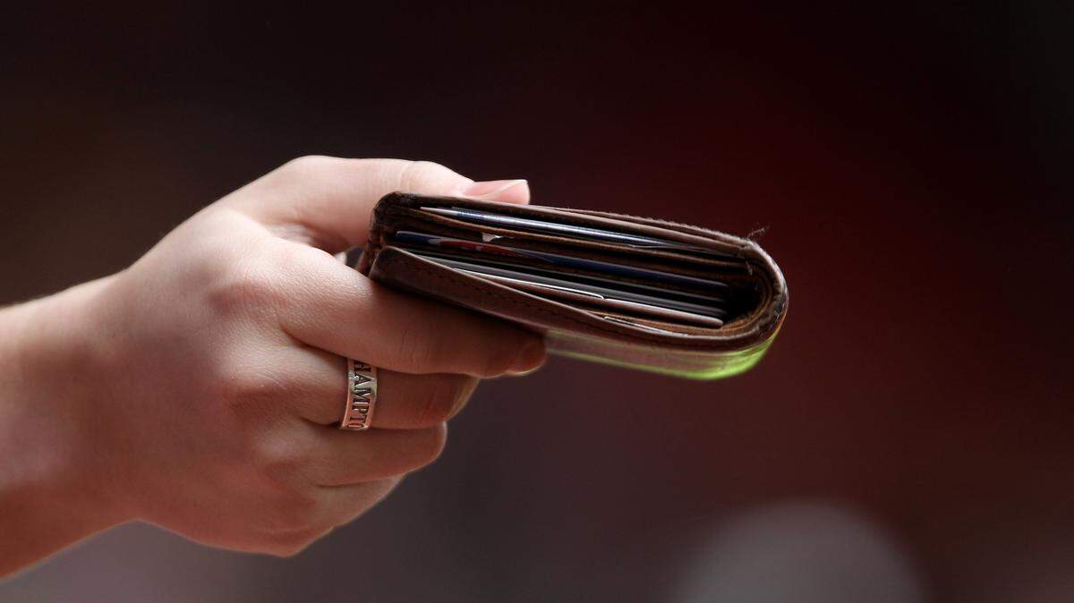 Someone holding their wallet.