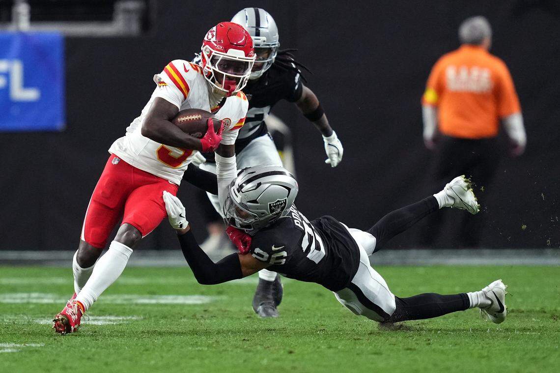 Kansas City Chiefs receiver Hollywood Brown (No. 5) is tackled by the Raiders’ Darien Porter during an NFL Week 18 game at Allegiant Stadium in Las Vegas on Sunday, January 4, 2026.