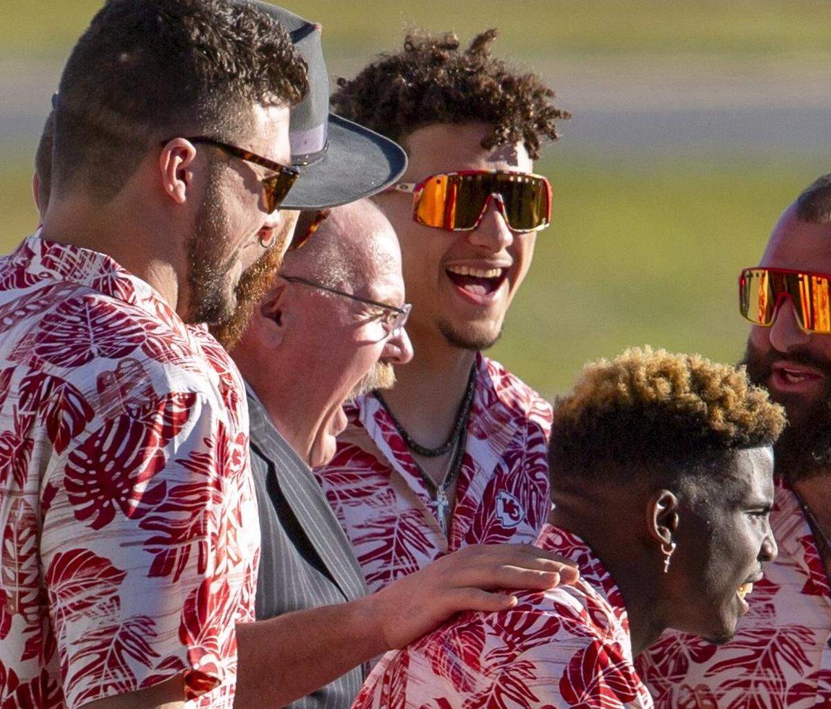 The Kansas City Chiefs made their first Super Bowl statement upon arrival at Miami International Airport on Jan. 26, 2020, surrounding head coach Andy Reid, center, decked out in his signature attire: Hawaiian shirts.