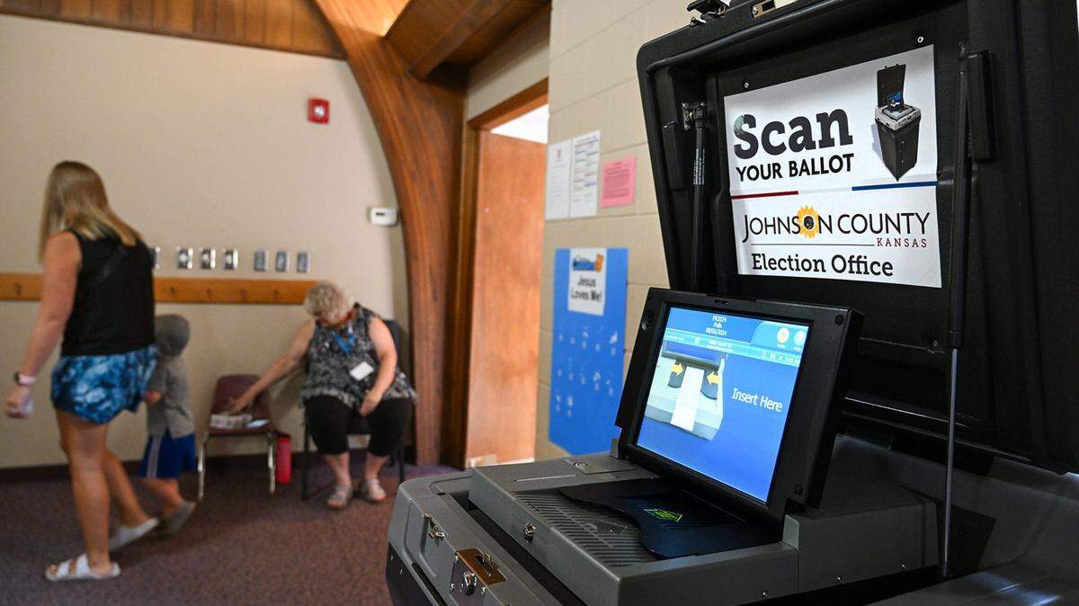 A voter arrives to vote in the Primary Election at the Community Bible Church on Tuesday, Aug. 6, 2024, in Olathe.