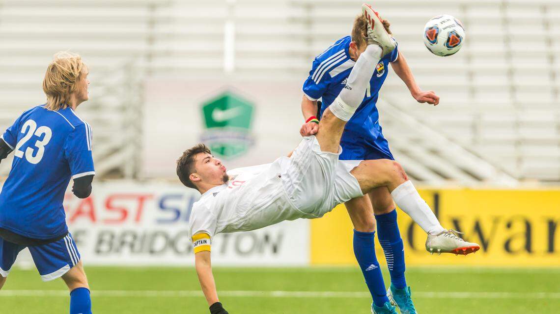 Guadalupe Centers’ David Portillo goes up for a bicycle kick during the Aztecs’ Class 2 state-championship soccer match against Priory Saturday in Fenton, Missouri.