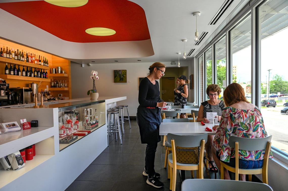 Tracy McCarthy takes a lunch order at André’s Confiserie Suisse — Kansas City.