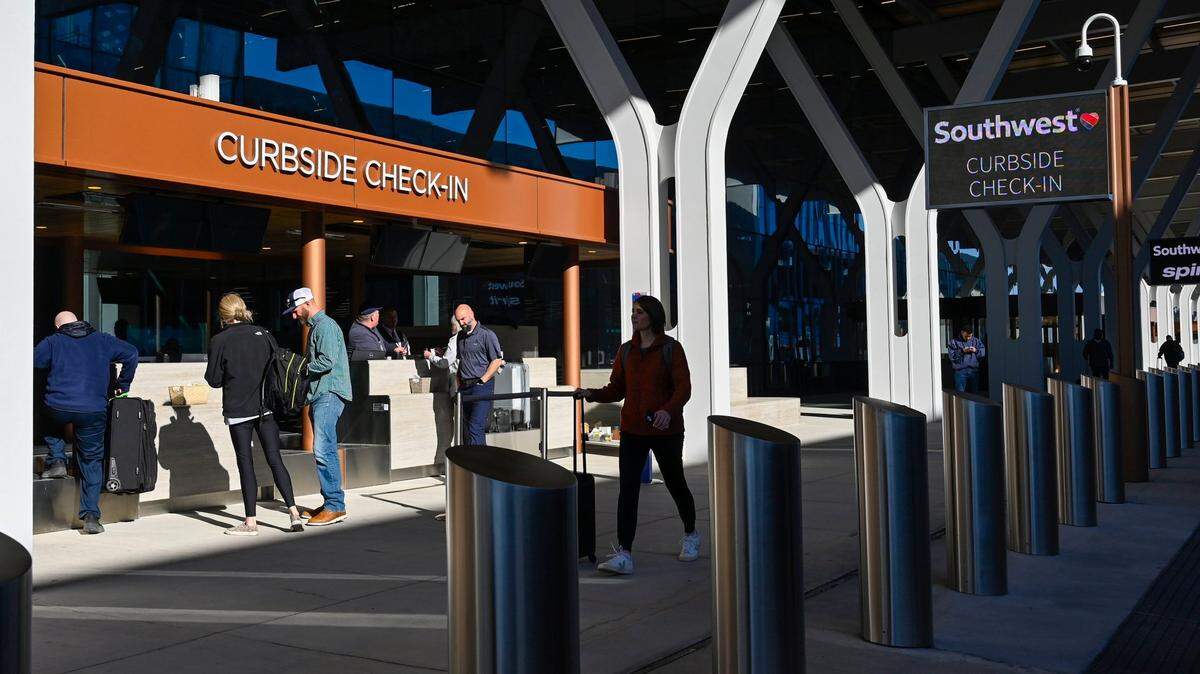 Travelers used curbside checki-in for their luggage at the new $1.5 billion single terminal at Kansas City International Airport, which opened to travelers Tuesday, Feb. 28, 2023.