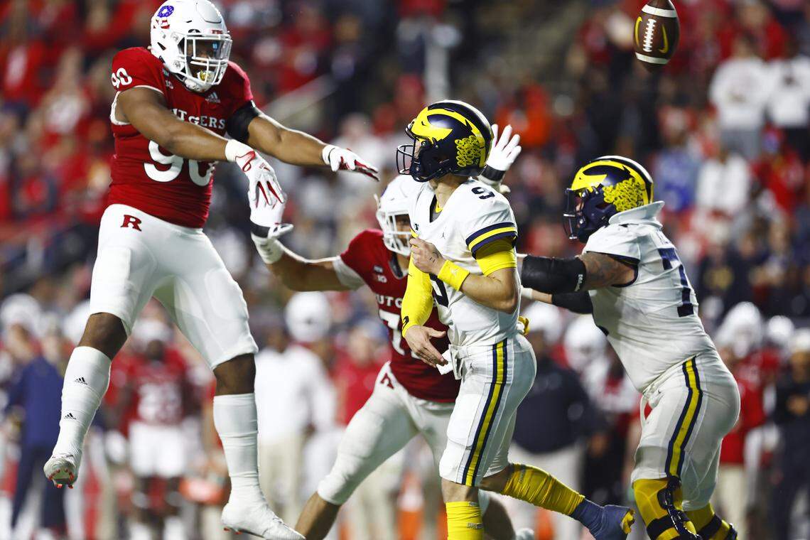 Rene Konga #90 of the Rutgers Scarlet Knights blocks a pass by quarterback J.J. McCarthy #9 of the Michigan Wolverines during the second quarter of a game at SHI Stadium on November 5, 2022 in Piscataway, New Jersey.