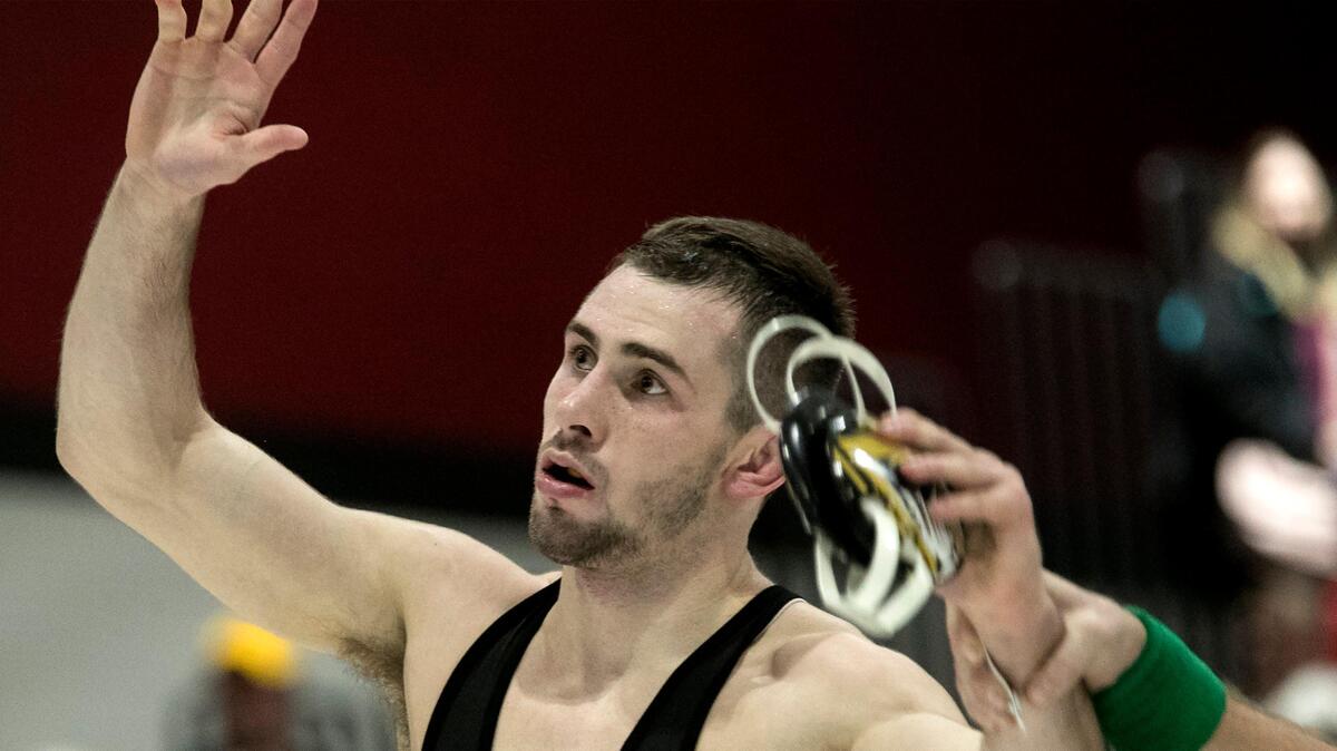 John Erneste, of Mizzou won the 133 lb. match against Louie Hayes of Virginia Thursday, December 20, 2018 at Park Hill High School. Esneste went to Park Hill high school.