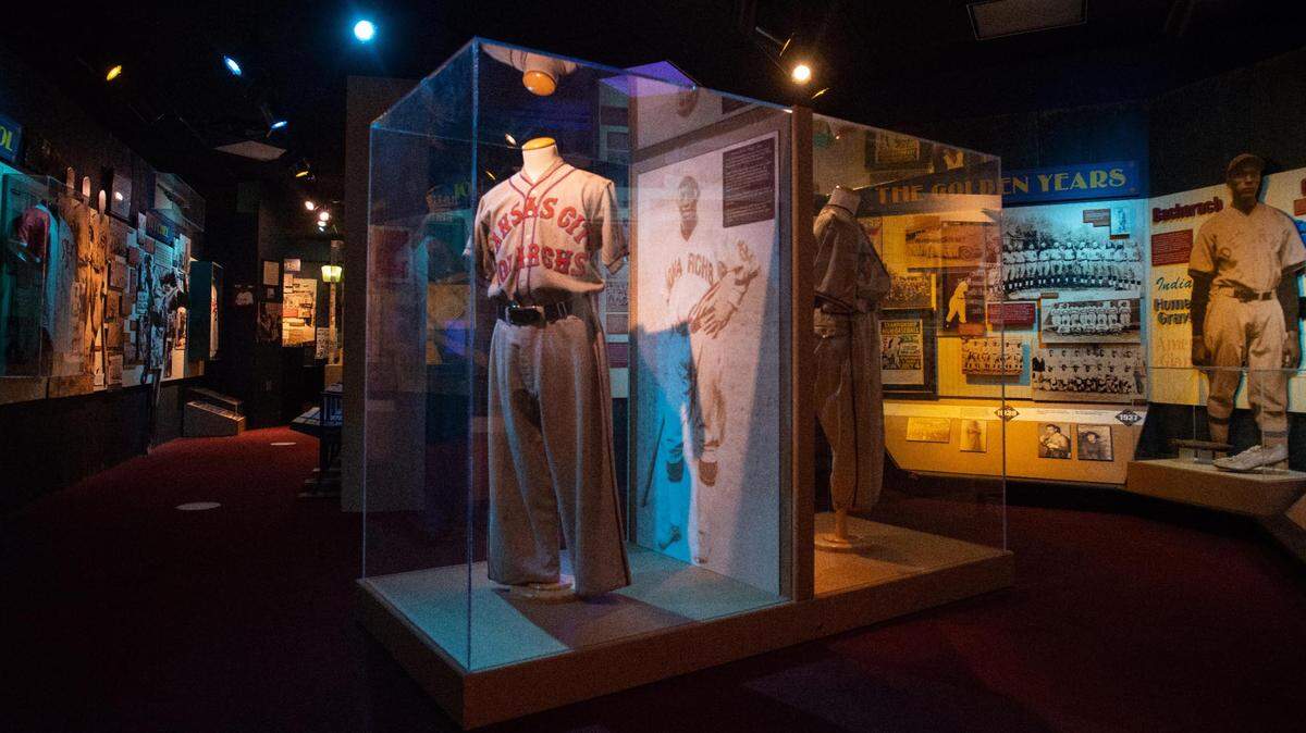 A large display case preserves an original Kansas City Monarchs baseball uniform within ‘The Golden Year’s’ exhibit inside the Negro Leagues Baseball Museum in Kansas City on Oct. 5, 2021.