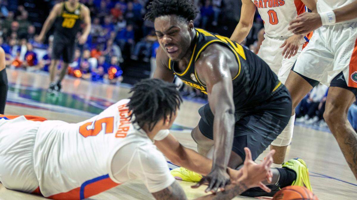 Florida guard Will Richard (5) battles Missouri guard Kobe Brown (24) for the ball during the first half on Saturday, Jan. 14, 2023, in Gainesville, Fla.