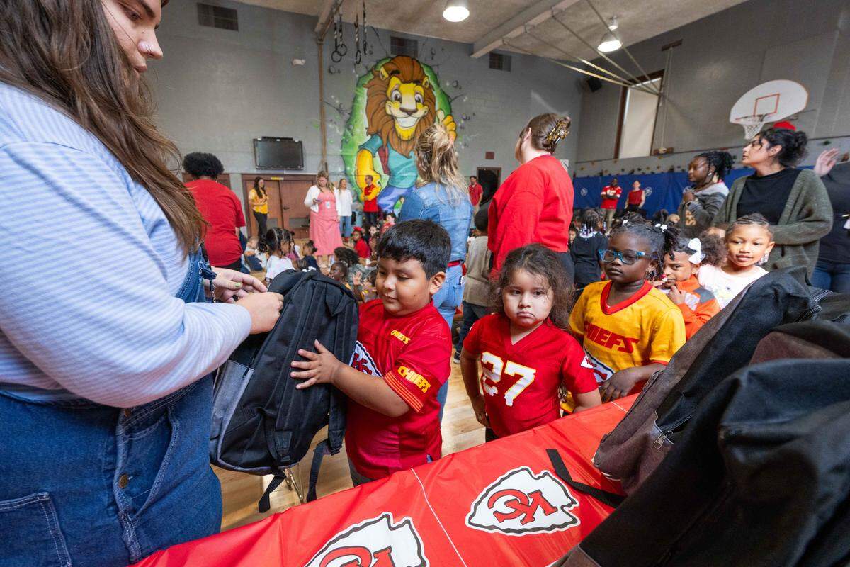 Students at Gordon Parks Elementary School received free backpacks with supplies courtesy of Kansas City Chiefs cornerback Trent McDuffie, on Monday, Aug. 25, 2025, in Kansas City. In addition to signing autographs, McDuffie donated the backpacks, which also included water bottles and school supplies, to 150 kids at the school through his T22 McDuffie Foundation.