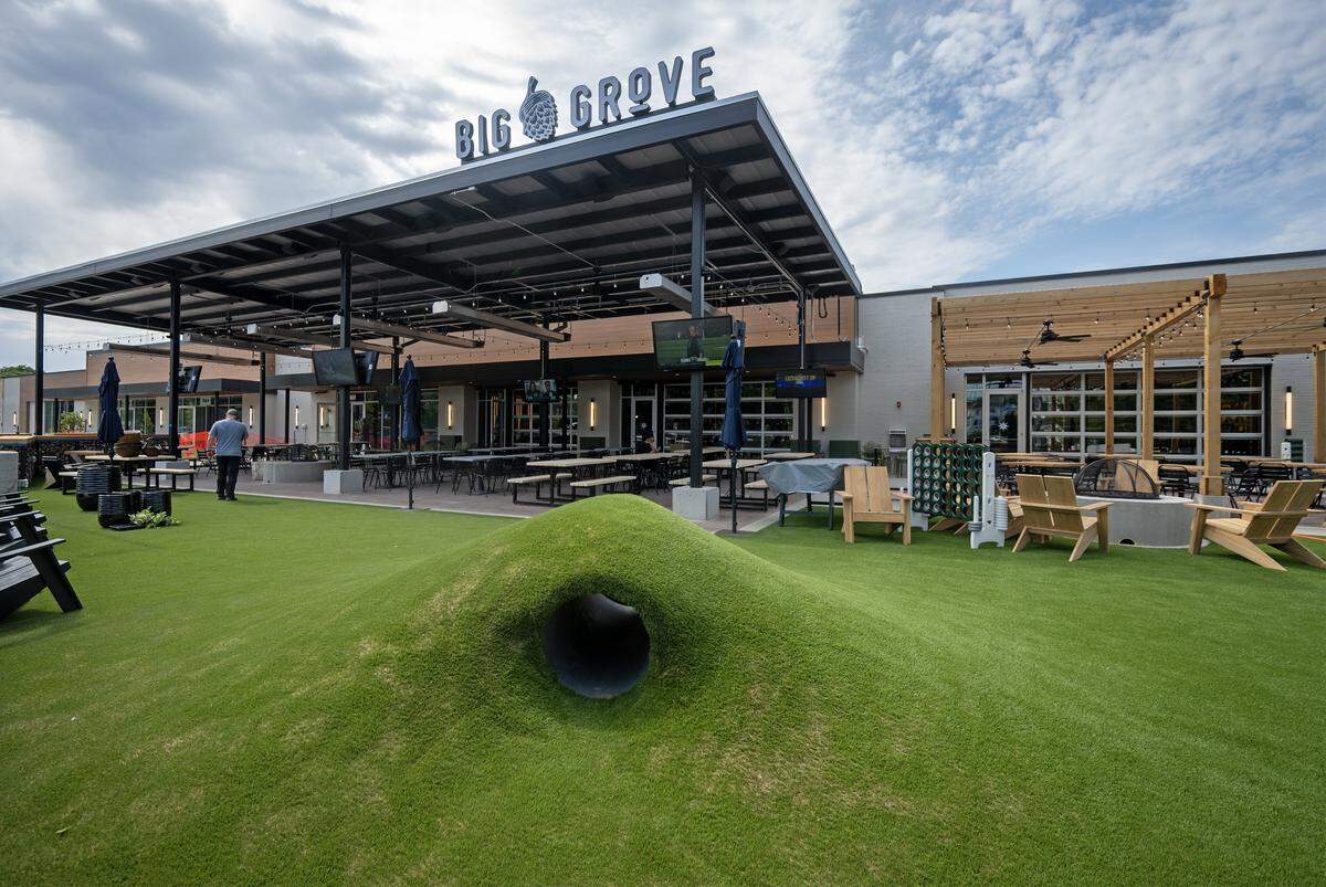 An expansive outdoor patio at Big Grove Brewery features fire pits, yard games, and patio seating and an artificial turf area in Prairie Village on Thursday, May 14, 2026. The 12,000-square-foot taproom, which also includes multiple outdoor televisions, is located in the former Macy's building at 7060 Mission Rd. and is scheduled to open May 21.