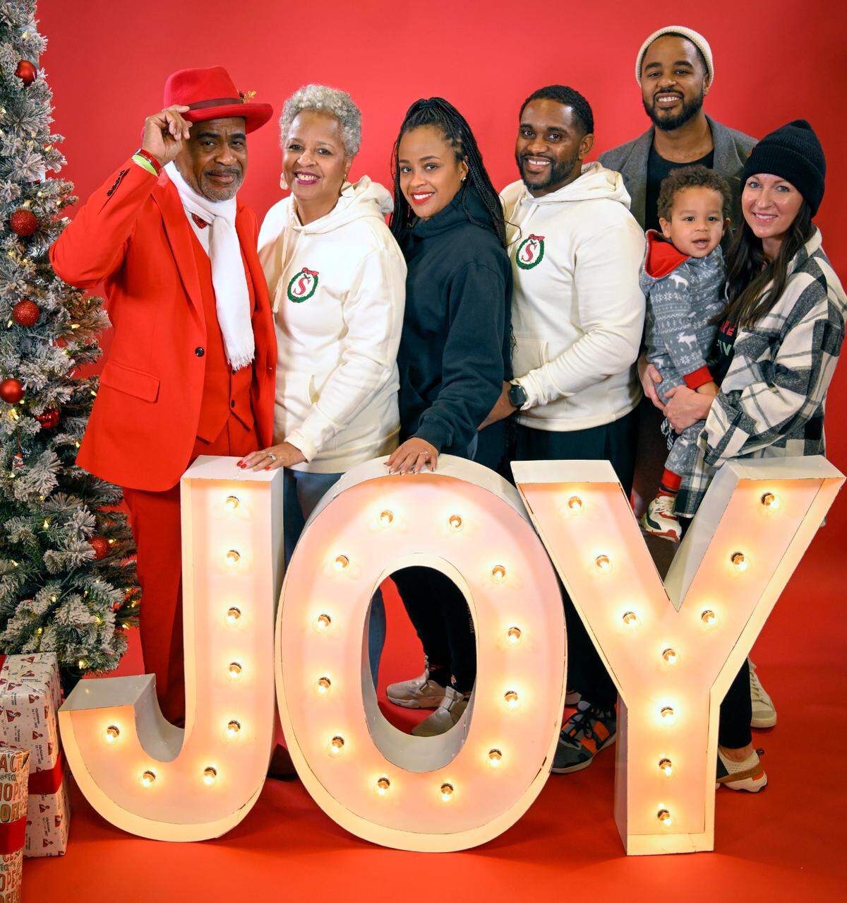 Tucker Lott, left, posed for a portrait with his family at the Soul of Santa breakfast. Lott, who portrays the Black Santa, is the founder of the Soul of Santa Do Good Foundation, which has partnered with The Star to do family portraits for the last two years.