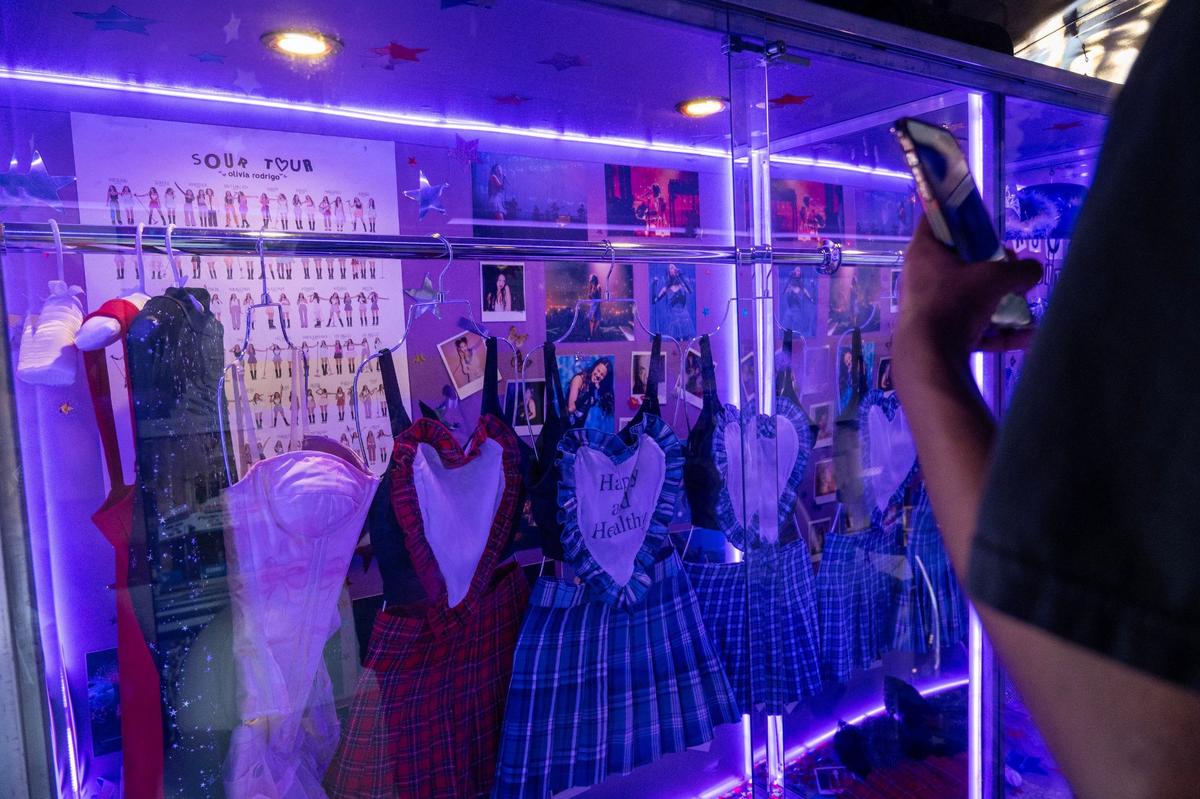 Olivia Rodrigo Guts World Tour concert costumes are displayed inside a glass case before her Guts World Tour concert at T-Mobile Center on Friday, July 26, 2024, in Kansas City.