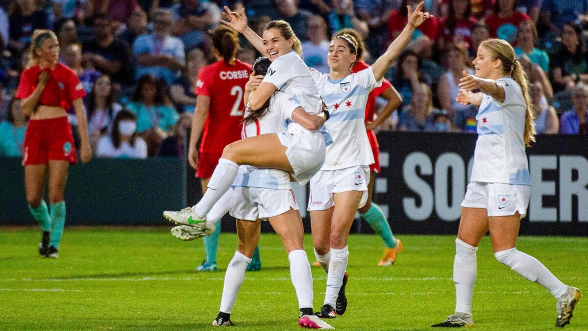 Chicago Red Stars’s Kealia Watt (2) celebrates with Chicago Red Stars’s Vanessa DiBernardo (10) after Watt scores the first goal of the game Wednesday, May 26, 2021 at Legend’s field in Kansas City, Kansas. Chicago Red Stars’s Mallory Pugh (9) assisted in the goal.