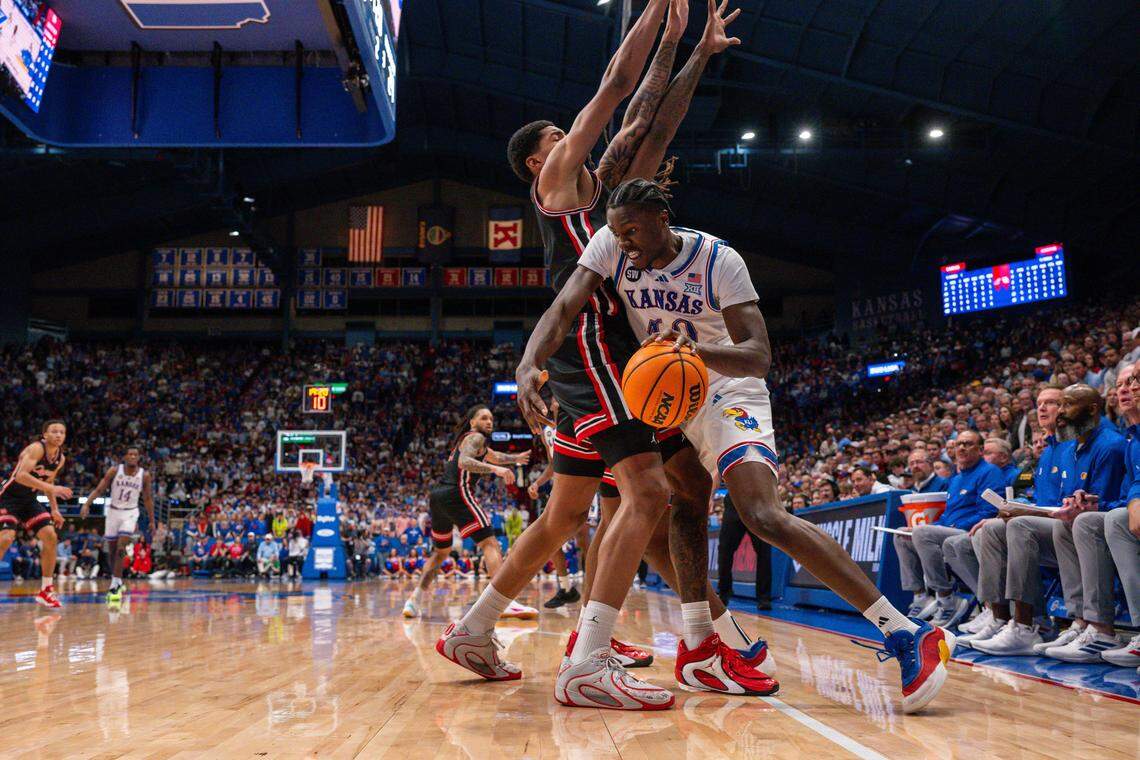 Kansas Jayhawks forward Flory Bidunga (40) drives around a double team in the second half vs. the Houston Cougars on Monday, February 23, 2026, at Allen Fieldhouse.