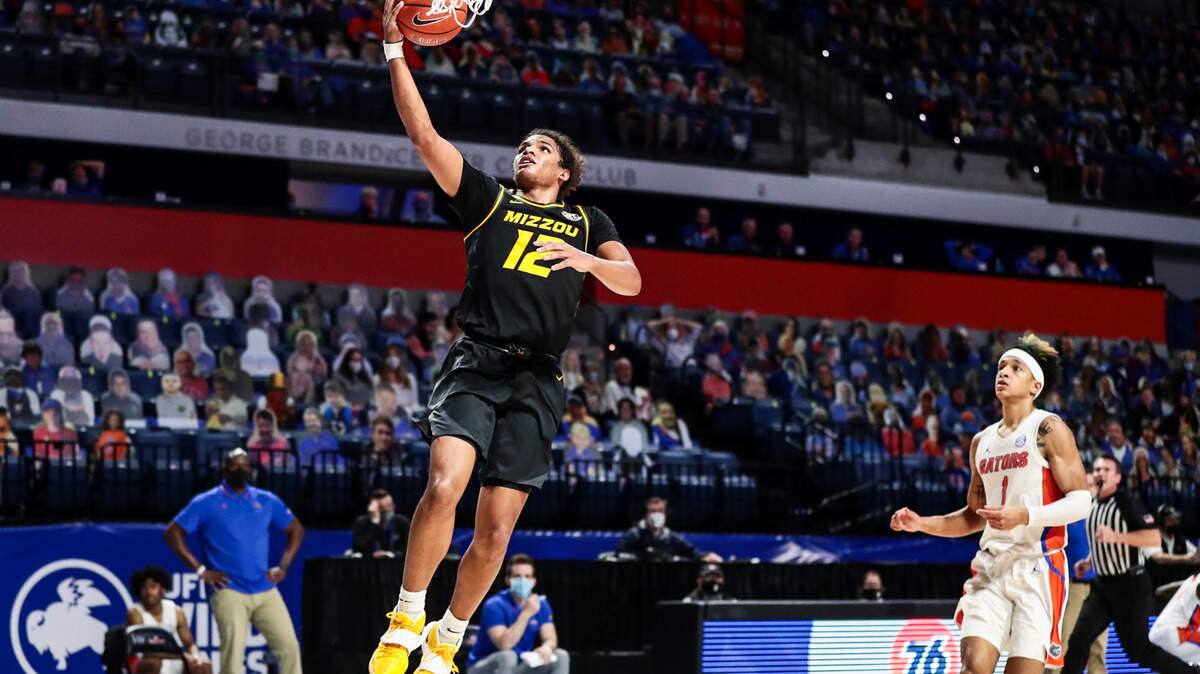 Mizzou guard Dru Smith (12) goes up for a layup against the Florida Gators at Exactech Arena in Gainesville on Wednesday, March 3, 2021. Smith later made a reverse layup with under a second to play that gave Mizzou the 72-70 victory.