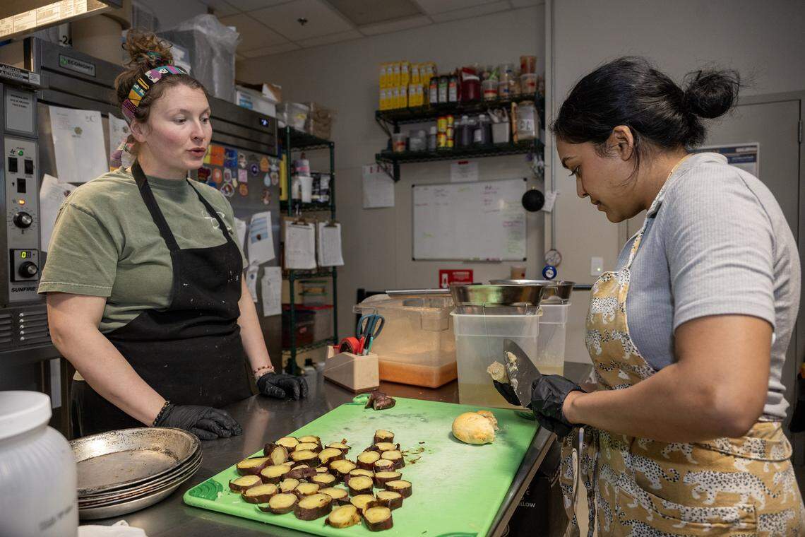 Sous chef de cuisine Emily Thomas, left, and chef/owner Swetha Newcomb worked on a new focaccia bread dish with in the kitchen at Of Course Kitchen & Co., 7753 W. 159th St. in Overland Park, on Wednesday, Feb. 25, 2026.