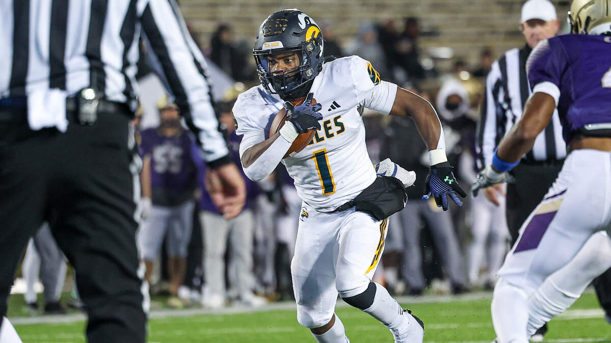 Senior running back Micahjo Barnett picks up yardage for Liberty North during the Eagles’ state championship game Saturday against Christian Brothers College at Mizzou’s Faurot Field in Columbia.