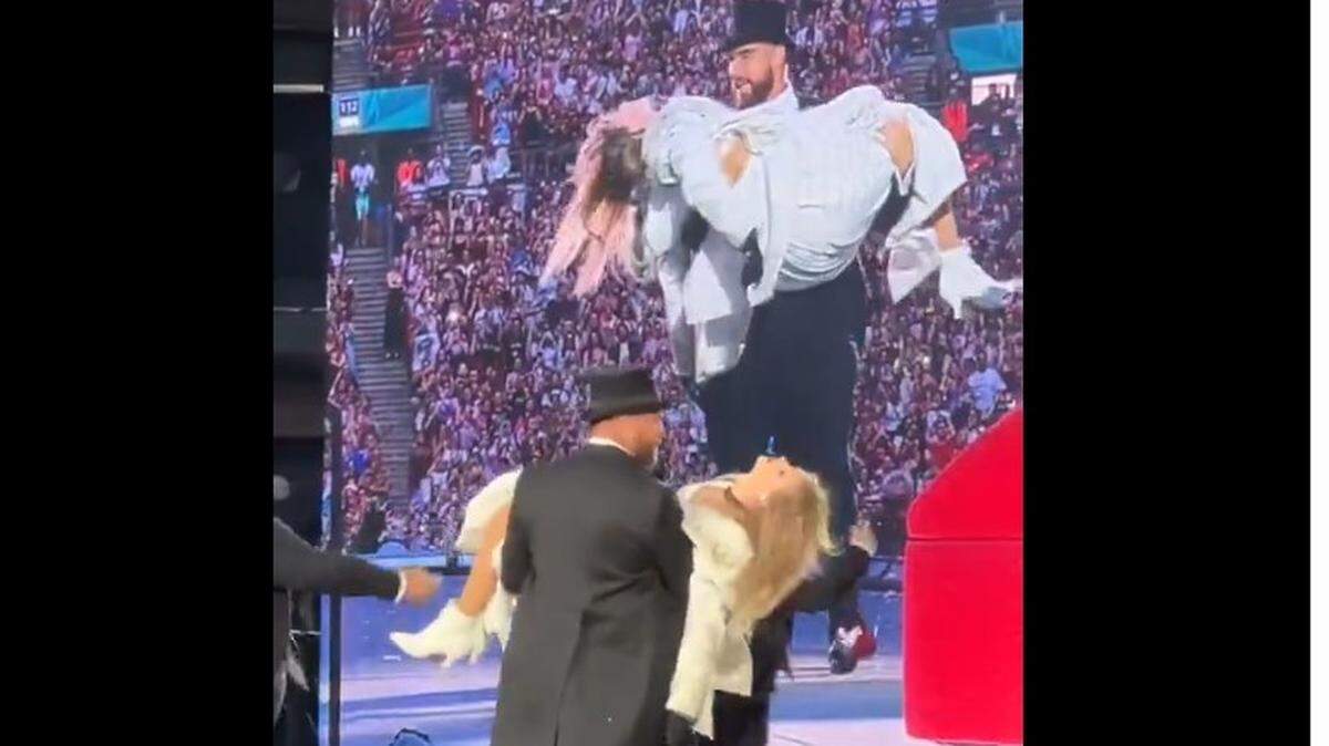 Travis Kelce and Taylor Swift on stage in London.