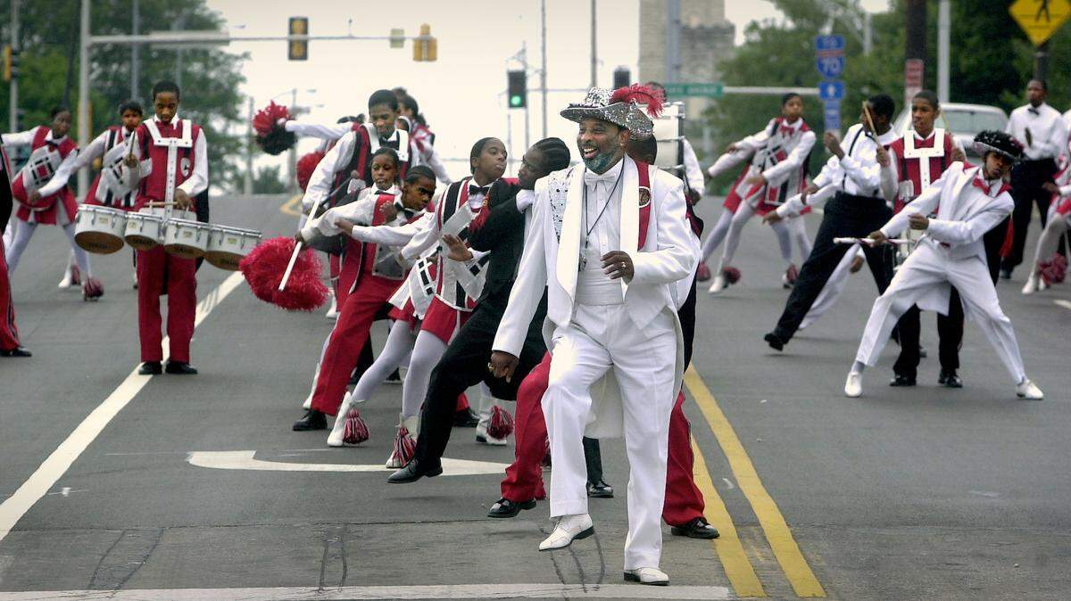 Willie A. Smith and the Cobras strut down Fifth Street in Kansas City, Kan., in 2003 during a parade.