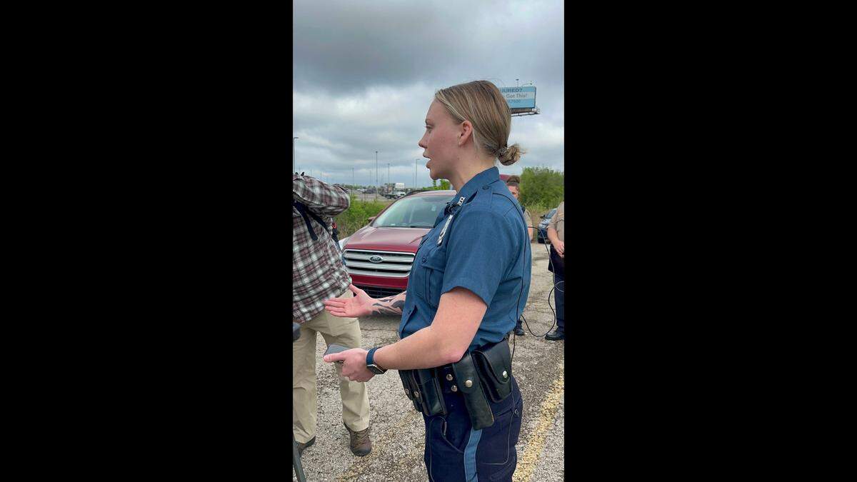 Officer Alayna Gonzalez, a spokeswoman with the Kansas City Police Department, speaks with media after a fatal officer-involved shooting Thursday. Two Riverside police officers and a Platte County sheriff’s deputy shot and killed a suspect who allegedly pointed a firearm at officers.
