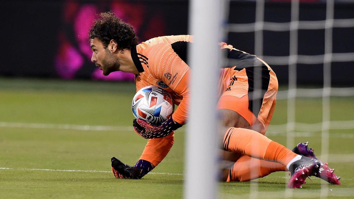 Sporting Kansas City goalkeeper John Pulskamp makes a save during Sunday night’s match at Children’s Mercy Park.