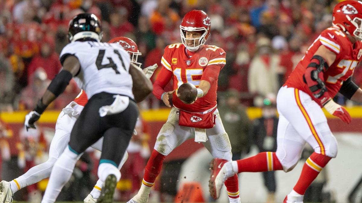 Kansas City Chiefs quarterback Patrick Mahomes (15) hands the ball off during an NFL divisional round playoff game against the Jacksonville Jaguars at GEHA Field at Arrowhead Stadium on Saturday, Jan. 21, 2023, in Kansas City.