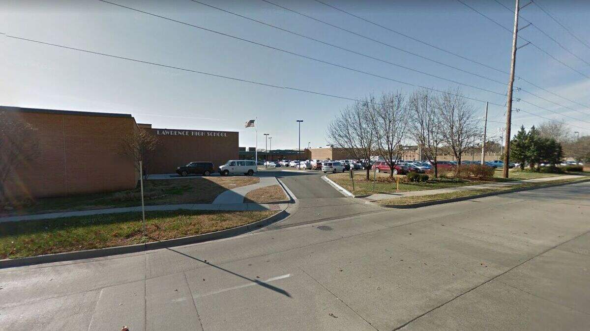 Two teenagers have been arrested for participating in a gun sale on the Lawrence High School campus. The gun was taken from a parent, school officials said.