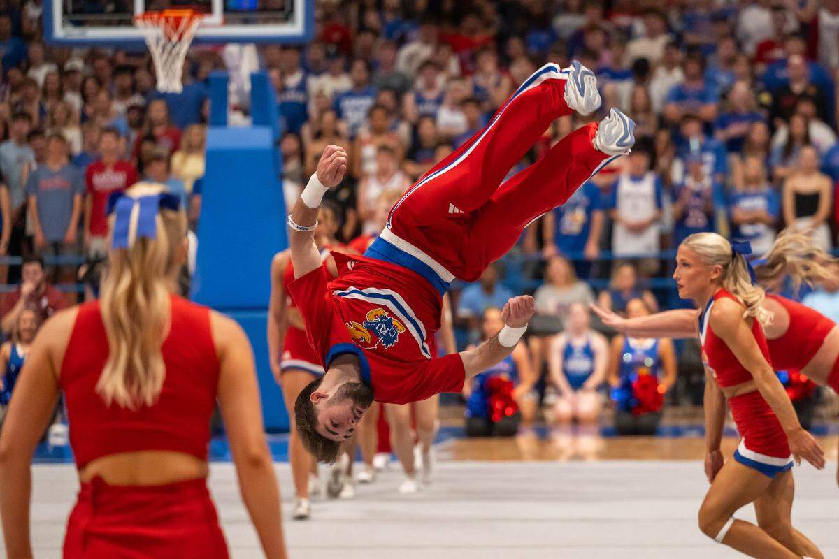 The Kansas Jayhawk cheerleaders perform acrobatics during Late Night in the Phog, on Friday, October 17, 2025, in Lawrence.