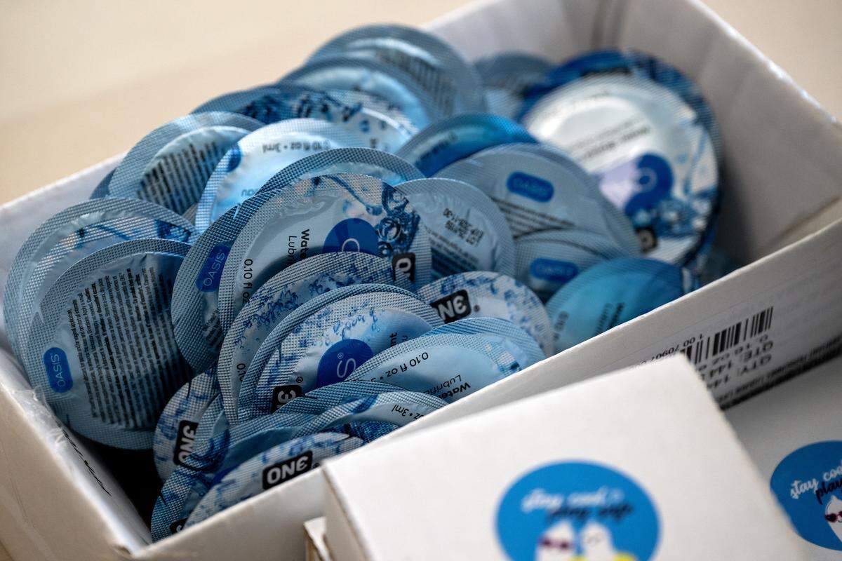 Packets of lubricant sit in a box among supplies used to assemble safer-sex kits at Our Spot KC on Thursday, June 4, 2026, in Kansas City.