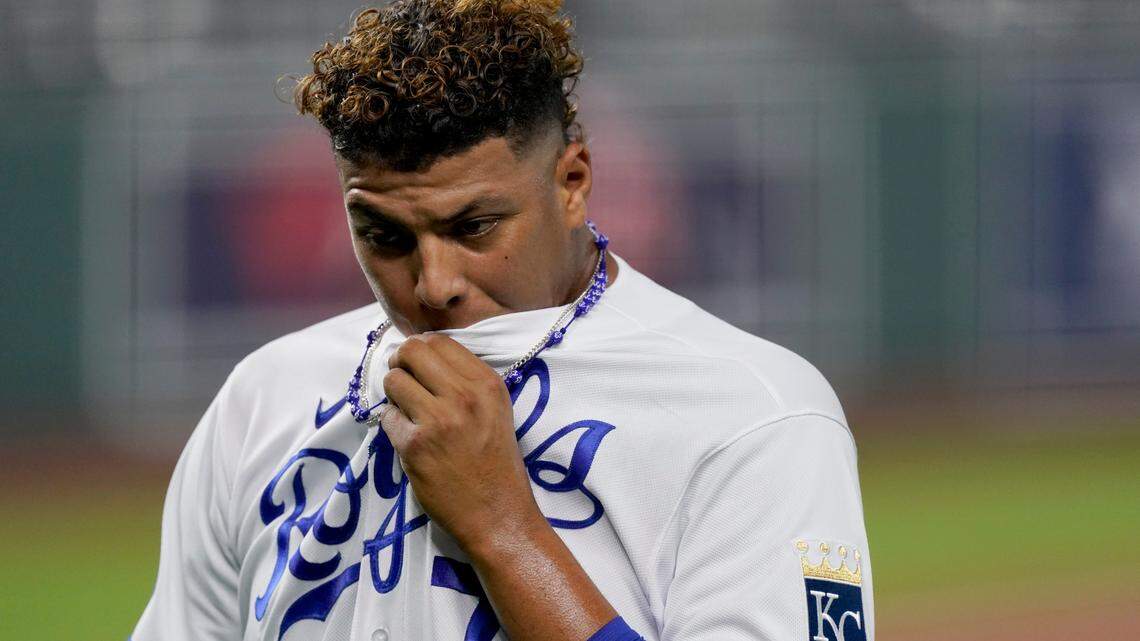 Kansas City Royals relief pitcher Carlos Hernandez wipes away sweat as he walks to the dugout during the third inning of a baseball game against the Cleveland Indians Tuesday, Sept. 1, 2020, in Kansas City, Mo. (AP Photo/Charlie Riedel)