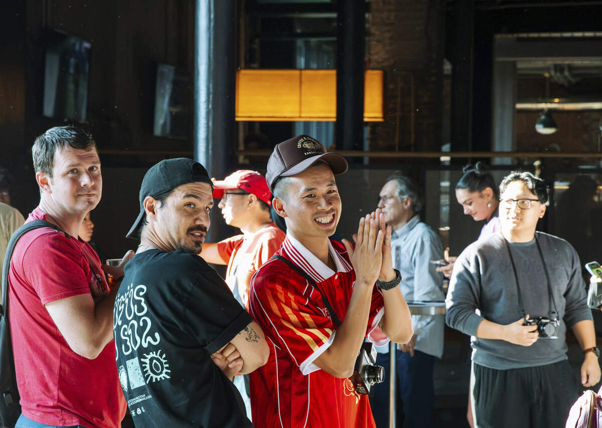 Frank Pham (center, red shirt) created Coffee and Cameras KC, a free monthly meetup to host photo walks in Kansas City, offering workshops, portrait setups and community for all skill levels.