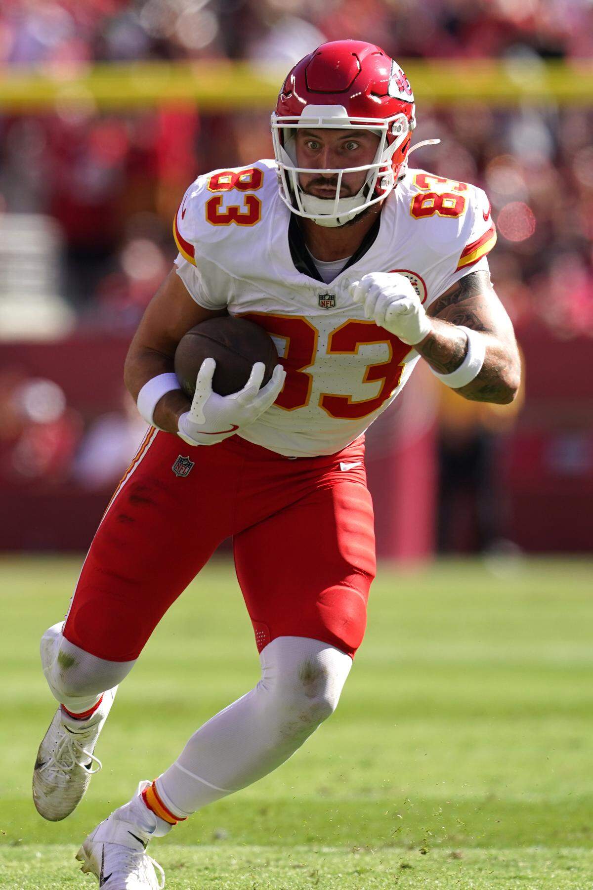 Kansas City Chiefs tight end Noah Gray (83) runs with the ball after making a catch against the San Francisco 49ers in the first quarter at Levi’s Stadium.
