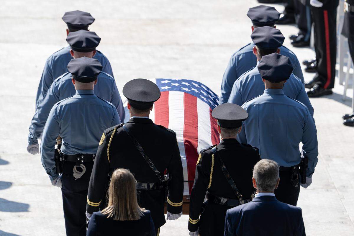First responders carry out the casket of Officer Hunter Simoncic onto the field during his memorial service at Children's Mercy Park on Wednesday, Sept. 3, 2025, in Kansas City, Kansas. Simoncic was killed Aug. 26 after being struck by a fleeing driver while deploying stop sticks.