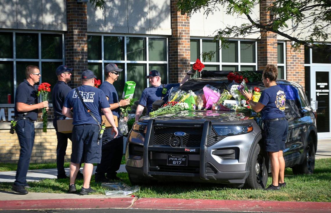 Members of the North Kansas City Fire Department paid tribute to fallen North Kansas City Police officer Daniel Vasquez, who died in the line of duty Tuesday after being fatally shot during a traffic stop at 21st Avenue and Clay Street in North Kansas City. Outside of the police department, the officer’s police vehicle has been laden with flowers since his passing.