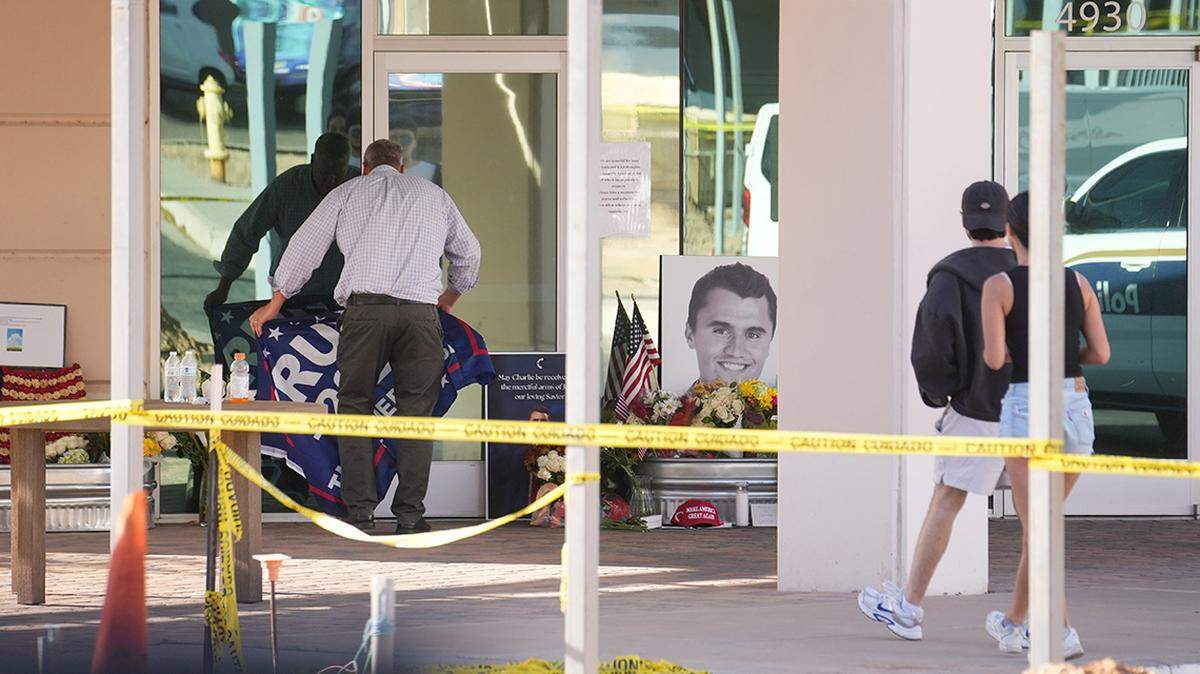 People congregate at Turning Point USA headquarters in Phoenix on Sept. 10 after news that the founder, Charlie Kirk, was shot and killed at a rally in Utah earlier that day.