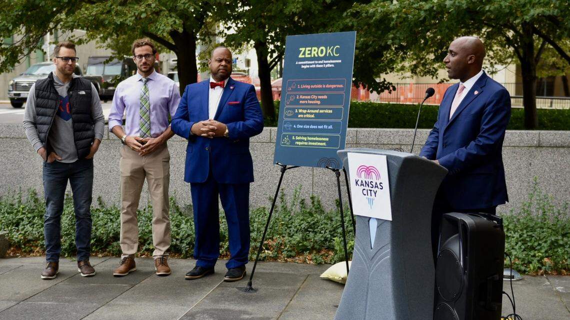 Kansas City Mayor Quinton Lucas presents the city’s new strategic plan to end homelessness, called Zero KC, outside City Hall on Thursday, Sept. 22, 2022. Houseless prevention coordinator Josh Henges, city manager Brian Platt and public works director Michael Shaw stands nearby.