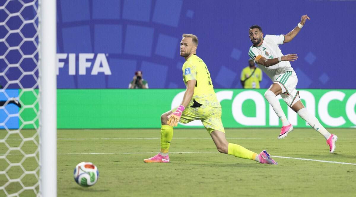 Algeria forward Riyad Mahrez (7) scores goal past Austria goalkeeper Alexander Schlager (1) in stoppage time during a FIFA World Cup group-stage soccer match at Kansas City (Arrowhead) Stadium in Kansas City on Saturday, June 27, 2026.