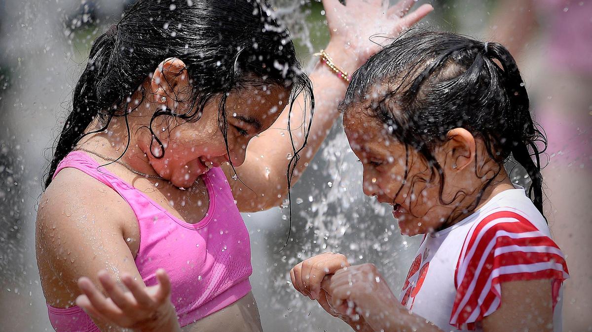 File photo. Children enjoy the sprayground at Loose Park in Kansas City.