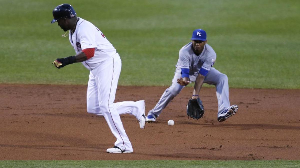 
Royals shortstop Alcides Escobar fields a grounder as Red Sox designated hitter David Ortiz eludes the ball during Thursday's baseball game in Boston. 
