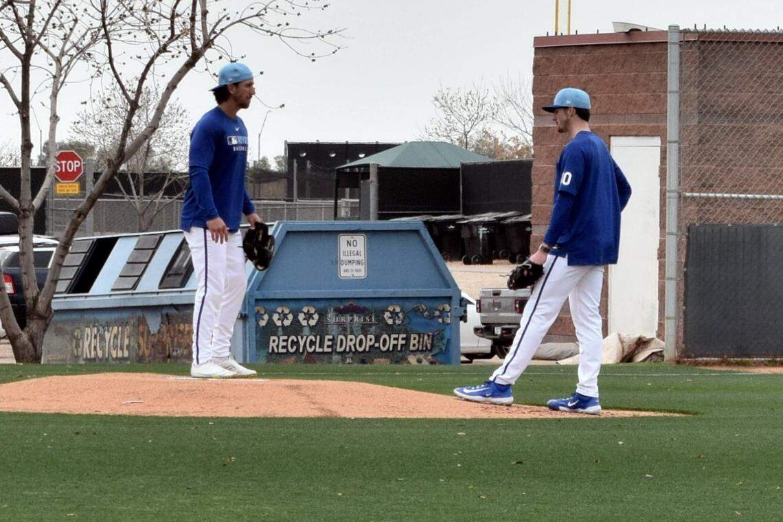 Kansas City Royals pitchers Michael Lorenzen (left) and Kyle Wright (right) chat on the conditioning field at the club’s spring training facility in Surprise, Arizona on Feb. 13, 2025