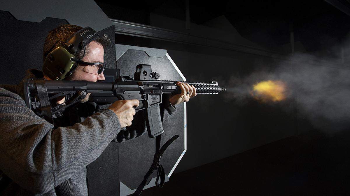 Suppressors have gained recent popularity in the industry, Michael Brown, CEO of Frontier Justice demonstrates an AR-15 without a suppressor attached to the rifle. There is a common misconception that a suppressor, also known as a silencer, are silent when attached to the end of a barrel of a gun when fired. According to Brown depending on the type of suppressor attached to a gun it can drop approximately 30 decibels on the sound of the discharged.   semiautomatic machine gun firearm semi-automatic