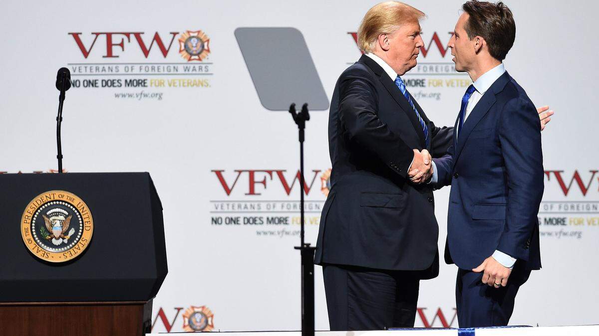 Then-President Donald Trump shakes Josh Hawley’s hand during a 2018 appearance in Kansas City. Hawley was elected to the U.S. Senate later that year.