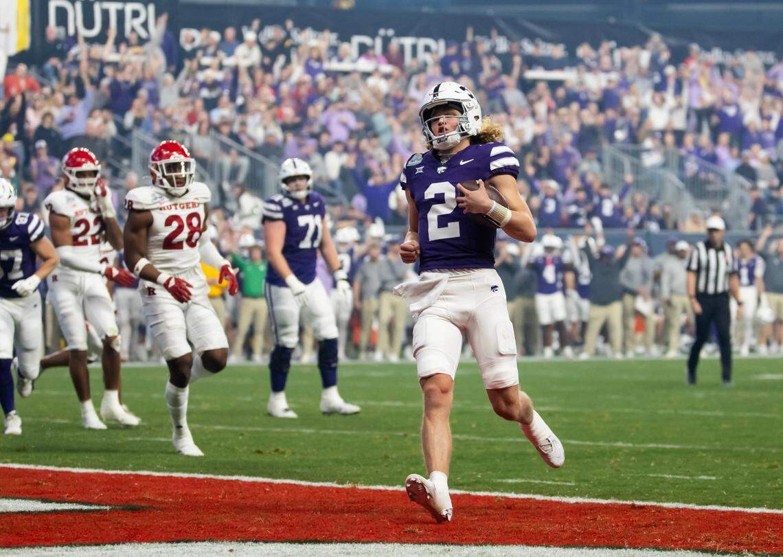 Kansas State Wildcats quarterback Avery Johnson (2) scores a touchdown against the Rutgers Scarlet Knights during the first half of the Rate Bowl at Chase Field on Dec. 26, 2024.